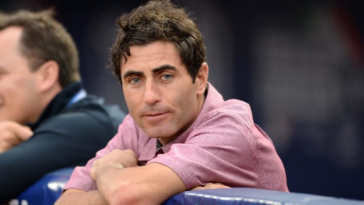 AJ Preller watches batting practice before the game against the Los Angeles Dodgers at Estadio de Beisbol Monterrey. 