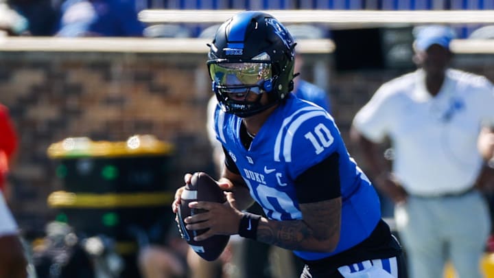 Oct 18, 2025; Durham, North Carolina, USA;  Duke Blue Devils quarterback Darian Mensah (10) runs with the ball  during the first half of the game against Georgia Tech Yellow Jackets at Wallace Wade Stadium. Mandatory Credit: Jaylynn Nash-Imagn Images