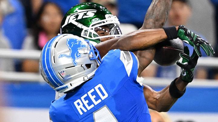 Sep 27, 2026; Detroit, Michigan, USA; New York Jets wide receiver Garrett Wilson (5) catches ball over Detroit Lions cornerback D.J. Reed (4) during the fourth quarter at Ford Field. Mandatory Credit: Lon Horwedel-Imagn Images Sep 27, 2026; Detroit, Michigan, USA; New York Jets wide receiver Garrett Wilson (5) catches ball over Detroit Lions cornerback D.J. Reed (4) during the fourth quarter at Ford Field. Mandatory Credit: Lon Horwedel-Imagn Images