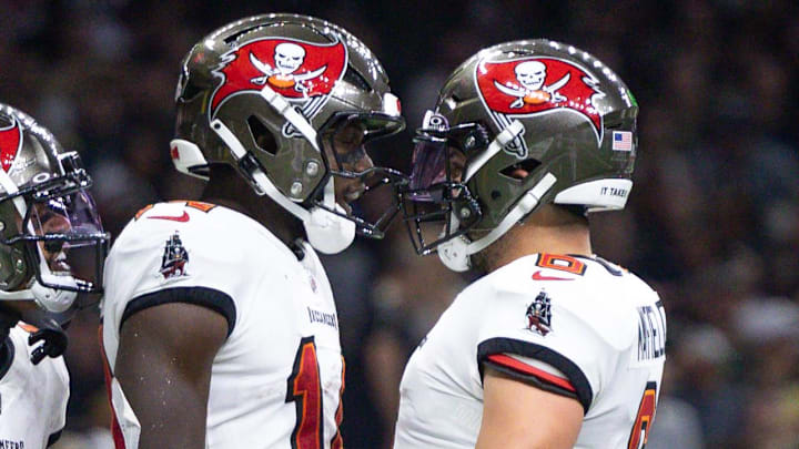 Oct 13, 2024; New Orleans, Louisiana, USA; Tampa Bay Buccaneers wide receiver Chris Godwin (14) and quarterback Baker Mayfield (6) celebrate a touchdown against the New Orleans Saints during he first half at Caesars Superdome. Mandatory Credit: Stephen Lew-Imagn Images Oct 13, 2024; New Orleans, Louisiana, USA; Tampa Bay Buccaneers wide receiver Chris Godwin (14) and quarterback Baker Mayfield (6) celebrate a touchdown against the New Orleans Saints during he first half at Caesars Superdome. Mandatory Credit: Stephen Lew-Imagn Images