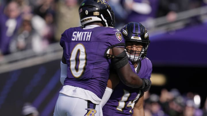 Nov 12, 2023; Baltimore, Maryland, USA; Baltimore Ravens safety Kyle Hamilton (14) celebrates with linebacker Roquan Smith (0) after scoring a touchdown against the Cleveland Browns during the first quarter at M&T Bank Stadium. Mandatory Credit: Jessica Rapfogel-USA TODAY Sports Nov 12, 2023; Baltimore, Maryland, USA; Baltimore Ravens safety Kyle Hamilton (14) celebrates with linebacker Roquan Smith (0) after scoring a touchdown against the Cleveland Browns during the first quarter at M&T Bank Stadium. Mandatory Credit: Jessica Rapfogel-USA TODAY Sports