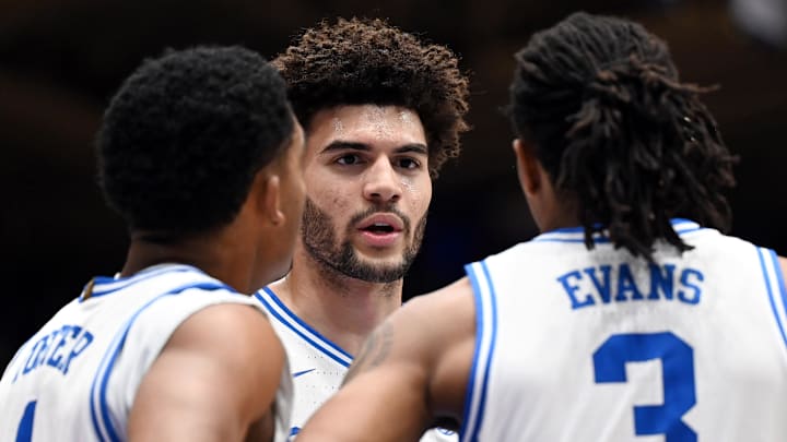 Feb 14, 2026; Durham, North Carolina, USA; Duke Blue Devils forward Cameron Boozer (12) huddles with teammates Caleb Foster (1) and Isaiah Evans (3) during the first half against the Clemson Tigers at Cameron Indoor Stadium. Mandatory Credit: Rob Kinnan-Imagn Images