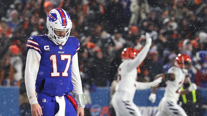 Buffalo Bills quarterback Josh Allen walks off the field after throwing an interception late in the fourth quarter at Highmark Stadium in Orchard Park, NY on Jan. 22 which ended their advancement in the playoffs. The Cincinnati Bengals players celebrate their victory. Buffalo Bills quarterback Josh Allen walks off the field after throwing an interception late in the fourth quarter at Highmark Stadium in Orchard Park, NY on Jan. 22 which ended their advancement in the playoffs. The Cincinnati Bengals players celebrate their victory.
