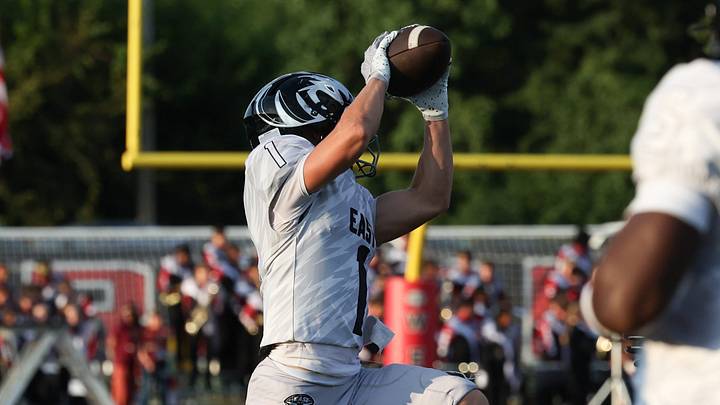 Braxton Thurman jumps to catch a first-quarter pass for the East offense. Lakota West hosts rival Lakota East in Week 2 of Ohio high school football action. Lakota West won 48-18. Thurman was one of many GMC receivers who had productive games last Friday. 