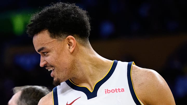 Mar 14, 2026; Los Angeles, California, USA; Denver Nuggets forward Spencer Jones (21) reacts during the first half against the Los Angeles Lakers at Crypto.com Arena. Mandatory Credit: William Liang-Imagn Images