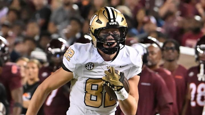 Sep 6, 2025; Blacksburg, Virginia, USA;  Vanderbilt Commodores tight end Brycen Coleman (82) runs for a touchdown after catching a pass during the second quarter at Lane Stadium. Mandatory Credit: Brian Bishop-Imagn Images