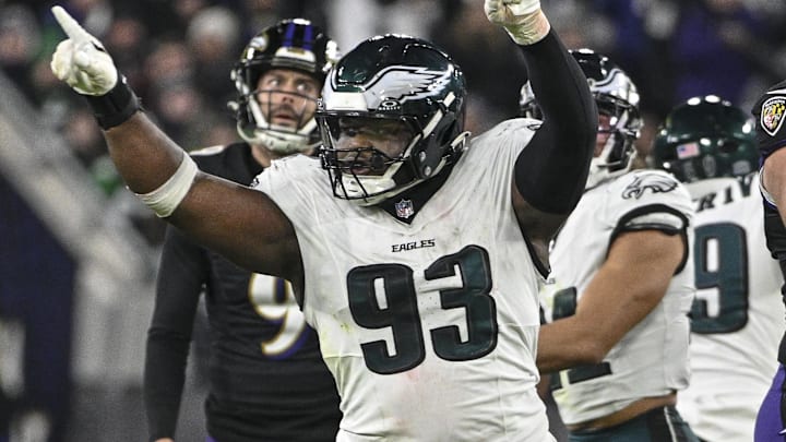 Dec 1, 2024; Baltimore, Maryland, USA; Philadelphia Eagles defensive tackle Milton Williams (93) celebrates as Baltimore Ravens place kicker Justin Tucker (9) reacts to missing a second half field goal at M&T Bank Stadium. Mandatory Credit: Tommy Gilligan-Imagn Images Dec 1, 2024; Baltimore, Maryland, USA; Philadelphia Eagles defensive tackle Milton Williams (93) celebrates as Baltimore Ravens place kicker Justin Tucker (9) reacts to missing a second half field goal at M&T Bank Stadium. Mandatory Credit: Tommy Gilligan-Imagn Images