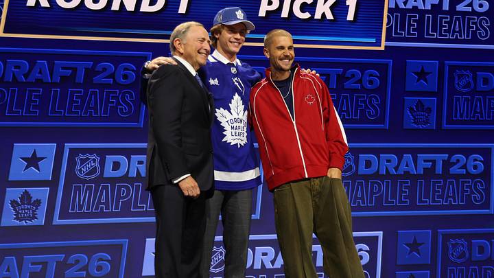 Jun 26, 2026; Buffalo, New York, USA; Gavin McKenna poses with NHL commissioner Gary Bettman and singer Justin Bieber after being selected with the first pick in the first round of the 2026 NHL Draft by the Toronto Maple Leafs at KeyBank Center. Mandatory Credit: Timothy T. Ludwig-Imagn Images