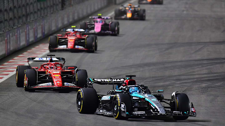 Nov 23, 2024; Las Vegas, Nevada, USA; Mercedes AMG Petronas driver George Russell (63) eads Scuderia Ferrari driver Charles Leclerc (16) during the Las Vegas Grand Prix at Las Vegas Circuit. Mandatory Credit: Gary A. Vasquez-Imagn Images