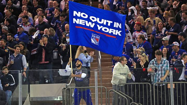 Jun 1, 2022; New York, New York, USA; New York Rangers fans celebrate behind a ÒNo Quit in New YorkÓ flag in the second period after a goal by New York Rangers center Filip Chytil (not pictured) against the Tampa Bay Lightning in game one of the Eastern Conference Final of the 2022 Stanley Cup Playoffs at Madison Square Garden. Mandatory Credit: Danny Wild-USA TODAY Sports Jun 1, 2022; New York, New York, USA; New York Rangers fans celebrate behind a ÒNo Quit in New YorkÓ flag in the second period after a goal by New York Rangers center Filip Chytil (not pictured) against the Tampa Bay Lightning in game one of the Eastern Conference Final of the 2022 Stanley Cup Playoffs at Madison Square Garden. Mandatory Credit: Danny Wild-USA TODAY Sports