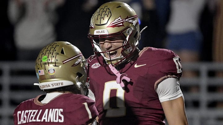Nov 1, 2025; Tallahassee, Florida, USA; Florida State Seminoles quarterback Tommy Castellanos (1) celebrates a touchdown with wide receiver Duce Robinson (0) during the second half against the Wake Forest Demon Deacons at Doak S. Campbell Stadium. Mandatory Credit: Melina Myers-Imagn Images