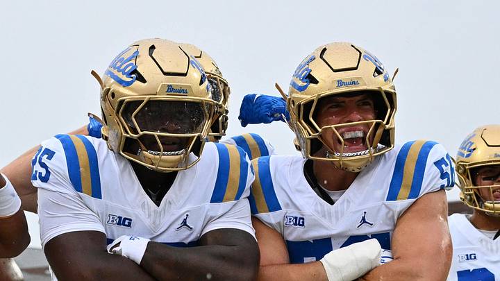 Sep 26, 2026; College Park, Maryland, USA;  UCLA Bruins linebacker Trent Hendrick (25), center with arms folded, leads the celebration in the end zone after making an interception in the second half against the Maryland Terrapins at SECU Stadium. Mandatory Credit: Jamie Sabau-Imagn Images