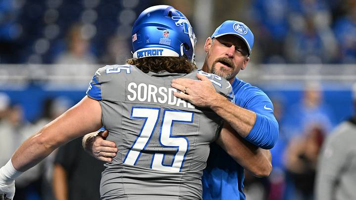 Detroit Lions head coach Dan Campbell greets offensive tackle Colby Sorsdal (75) during warmups Detroit Lions head coach Dan Campbell greets offensive tackle Colby Sorsdal (75) during warmups