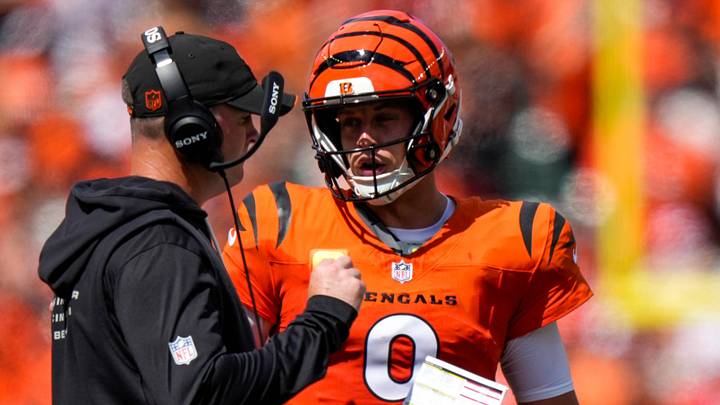 Cincinnati Bengals quarterback Joe Burrow (9) checks in with head coach Zac Taylor between plays in the second quarter of the NFL Week 1 game between the Cincinnati Bengals and the Tampa Bay Buccaneers at Paycor Stadium in Cincinnati on Sunday, Sept. 13, 2026. Cincinnati Bengals quarterback Joe Burrow (9) checks in with head coach Zac Taylor between plays in the second quarter of the NFL Week 1 game between the Cincinnati Bengals and the Tampa Bay Buccaneers at Paycor Stadium in Cincinnati on Sunday, Sept. 13, 2026.