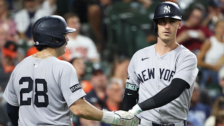 Sep 18, 2025; Baltimore, Maryland, USA; New York Yankees catcher Austin Wells (28) celebrates with New York Yankees outfielder Cody Bellinger (35) after scoring a run during the seventh inning against the Baltimore Orioles at Oriole Park at Camden Yards. Mandatory Credit: Daniel Kucin Jr.-Imagn Images