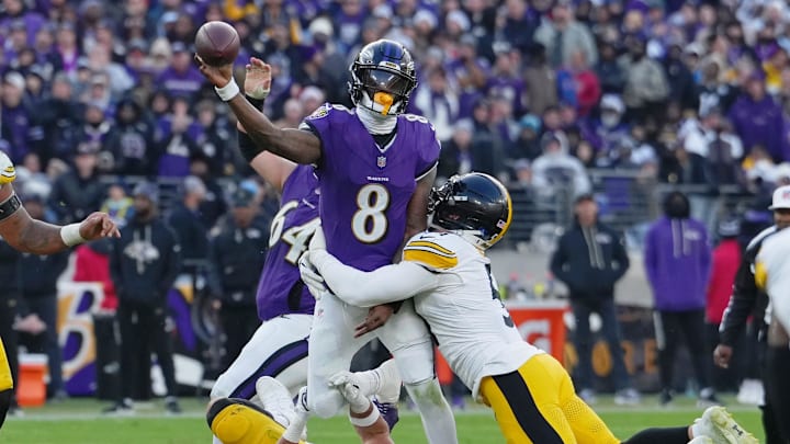 Dec 7, 2025; Baltimore, Maryland, USA; Baltimore Ravens quarterback Lamar Jackson (8) passes the ball while defended by Pittsburgh Steelers linebacker Alex Highsmith (56) and linebacker Nick Herbig (51) during the second half at M&T Bank Stadium. Mandatory Credit: Mitch Stringer-Imagn Images Dec 7, 2025; Baltimore, Maryland, USA; Baltimore Ravens quarterback Lamar Jackson (8) passes the ball while defended by Pittsburgh Steelers linebacker Alex Highsmith (56) and linebacker Nick Herbig (51) during the second half at M&T Bank Stadium. Mandatory Credit: Mitch Stringer-Imagn Images