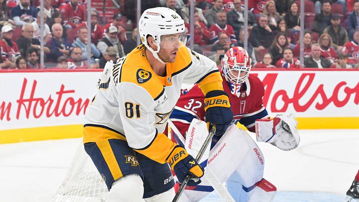 Oct 8, 2026; Montreal, Quebec, CAN;  Nashville Predators forward Jonathan Marchessault (81) plays the puck against the Montreal Canadiens during the third period at the Bell Centre.  Mandatory Credit: Eric Bolte-Imagn Images