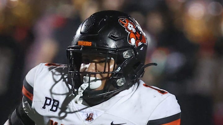 Massillon's Savior Owens runs the ball against Sunbury Big Walnut in an OHSAA Division II regional final, Friday, Nov. 21, 2025, in Zanesville.
