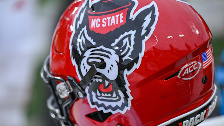Nov 11, 2023; Winston-Salem, North Carolina, USA; The North Carolina State Wolfpack helmet rests on the bench during the second half against the Wake Forest Demon Deacons at Allegacy Federal Credit Union Stadium. Mandatory Credit: William Howard-Imagn Images Nov 11, 2023; Winston-Salem, North Carolina, USA; The North Carolina State Wolfpack helmet rests on the bench during the second half against the Wake Forest Demon Deacons at Allegacy Federal Credit Union Stadium. Mandatory Credit: William Howard-Imagn Images