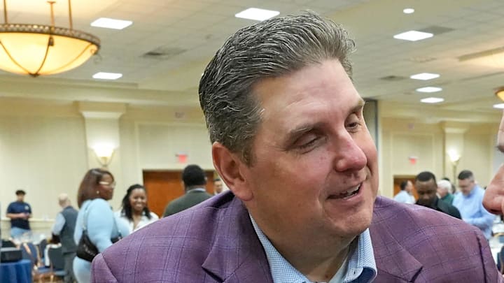 ESPN basketball analyst Brian Windhorst, a former Akron Beacon Journal sports reporter, left, catches up with his former sports editor Larry Pantages after speaking during an Akron Roundtable meeting, Feb. 19, 2026, in Akron, Ohio. ESPN basketball analyst Brian Windhorst, a former Akron Beacon Journal sports reporter, left, catches up with his former sports editor Larry Pantages after speaking during an Akron Roundtable meeting, Feb. 19, 2026, in Akron, Ohio.