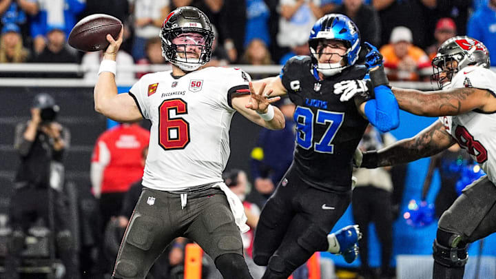 Tampa Bay Buccaneers quarterback Baker Mayfield (6) makes a pass against Detroit Lions defensive end Aidan Hutchinson (97) during the second half at Ford Field in Detroit on Monday, Oct. 20, 2025.