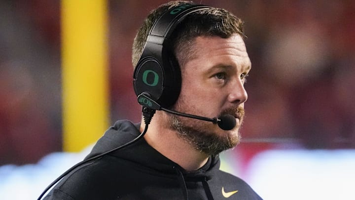 Nov 16, 2024; Madison, Wisconsin, USA; Oregon Ducks head coach Dan Lanning looks on during the first quarter against the Wisconsin Badgers at Camp Randall Stadium. Mandatory Credit: Jeff Hanisch-Imagn Images Nov 16, 2024; Madison, Wisconsin, USA; Oregon Ducks head coach Dan Lanning looks on during the first quarter against the Wisconsin Badgers at Camp Randall Stadium. Mandatory Credit: Jeff Hanisch-Imagn Images