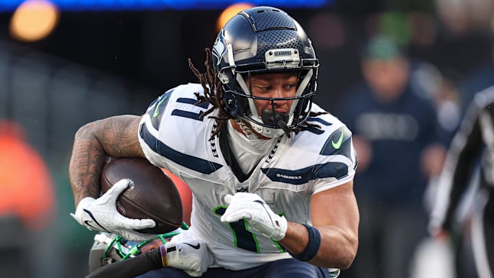 Dec 1, 2024; East Rutherford, New Jersey, USA; Seattle Seahawks wide receiver Jaxon Smith-Njigba (11) is tackled by New York Jets cornerback Michael Carter II (30) during the second half at MetLife Stadium. Dec 1, 2024; East Rutherford, New Jersey, USA; Seattle Seahawks wide receiver Jaxon Smith-Njigba (11) is tackled by New York Jets cornerback Michael Carter II (30) during the second half at MetLife Stadium.
