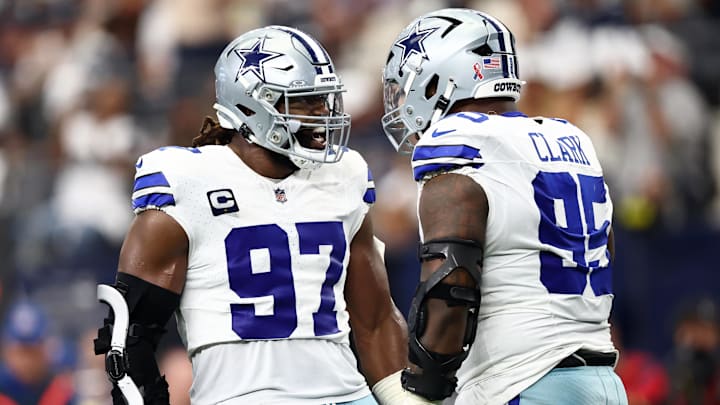Dallas Cowboys defensive tackle Osa Odighizuwa celebrates with Kenny Clark after a play against the New York Giants 