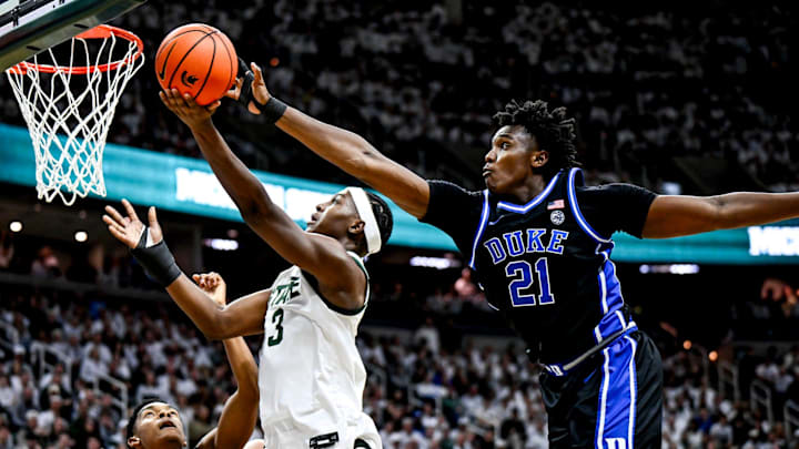 Michigan State's Cam Ward, left, is blocked by Duke's Patrick Ngongba during the first half on Saturday, Dec. 6, 2025, at the Breslin Center in East Lansing.