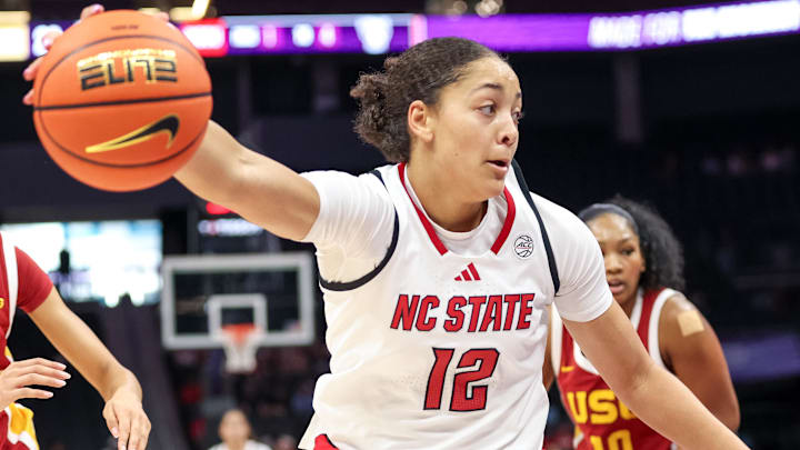 Nov 9, 2025; Charlotte, North Carolina, USA; NC State Wolfpack forward Khamil Pierre (12) controls the ball against the Southern California Trojans during the second quarter of the Ally Tipoff game at Spectrum Center. Mandatory Credit: Cory Knowlton-Imagn Images Nov 9, 2025; Charlotte, North Carolina, USA; NC State Wolfpack forward Khamil Pierre (12) controls the ball against the Southern California Trojans during the second quarter of the Ally Tipoff game at Spectrum Center. Mandatory Credit: Cory Knowlton-Imagn Images