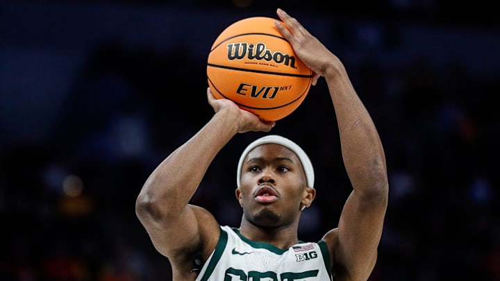Michigan State guard Tre Holloman (5) attempts a free throw against Minnesota during the second half of Second Round of Big Ten tournament at Target Center in Minneapolis, Minn. on Thursday, March 14, 2024.