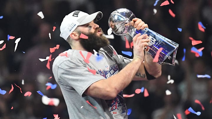 Feb 3, 2019; Atlanta, GA, USA; New England Patriots receiver Julian Edelman (right) kisses the Vince Lombardi trophy while being interviewed by CBS broadcaster Jim Nantz in Super Bowl LIII against the Los Angeles Rams at Mercedes-Benz Stadium. The Patriots defeated the Rams 13-3 to win an NFL record-tying sixth championship. Mandatory Credit: Kirby Lee-Imagn Images