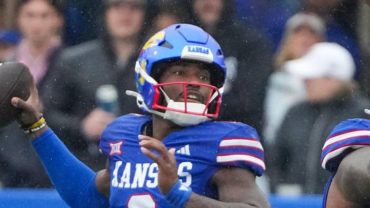 Kansas Jayhawks quarterback Jalon Daniels (6) throws a pass against the Kansas State Wildcats 