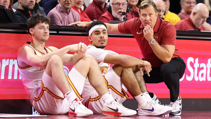 Jan 2, 2026; Ames, Iowa, USA;  Iowa State Cyclones head coach T.J. Otzelberger, guard Tamin Lipsey (3) and guard Nate Heise (0) watch the Cyclones play the West Virginia Mountaineers during the second half at James H. Hilton Coliseum.