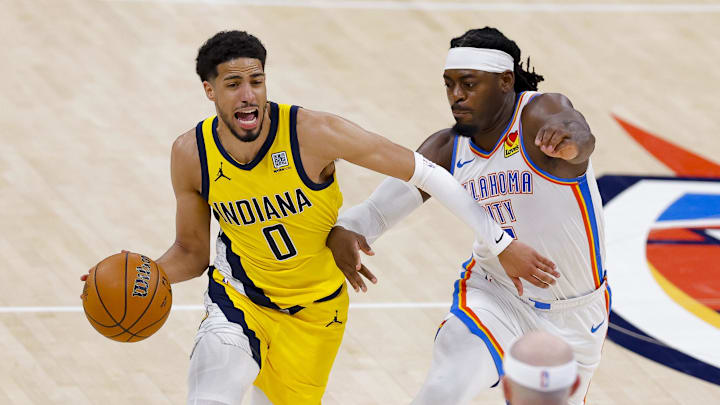 Jun 16, 2025; Oklahoma City, Oklahoma, USA; Indiana Pacers guard Tyrese Haliburton (0) drives to the basket past Oklahoma City Thunder guard Luguentz Dort (5) during the third quarter in game five of the 2025 NBA Finals at Paycom Center. Mandatory Credit: Alonzo Adams-Imagn Images