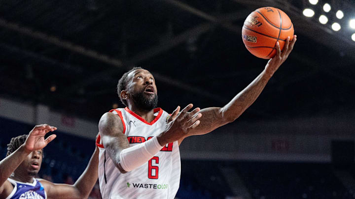 The Ville's Russ Smith (6) goes for a layup against Sideline Cancer's Marcellus Earlington (11) during their game on Monday, July 22, 2024 in Louisville, Ky. at Freedom Hall during the second round of The Basketball Tournament.
