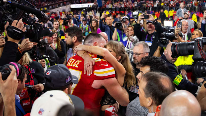 Feb 11, 2024; Paradise, Nevada, USA; Kansas City Chiefs tight end Travis Kelce (87) kisses girlfriend Taylor Swift as they celebrate after defeating the San Francisco 49ers in Super Bowl LVIII at Allegiant Stadium. Mandatory Credit: Mark J. Rebilas-Imagn Images