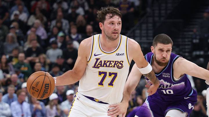 Oct 25, 2026; Salt Lake City, Utah, USA;  Los Angeles Lakers guard Luka Doncic (77) uses a screen by forward Kevon Looney (55) against Utah Jazz guard Svi Mykhailiuk (10) during the first half at Delta Center.  Mandatory Credit: Rob Gray-Imagn Images
