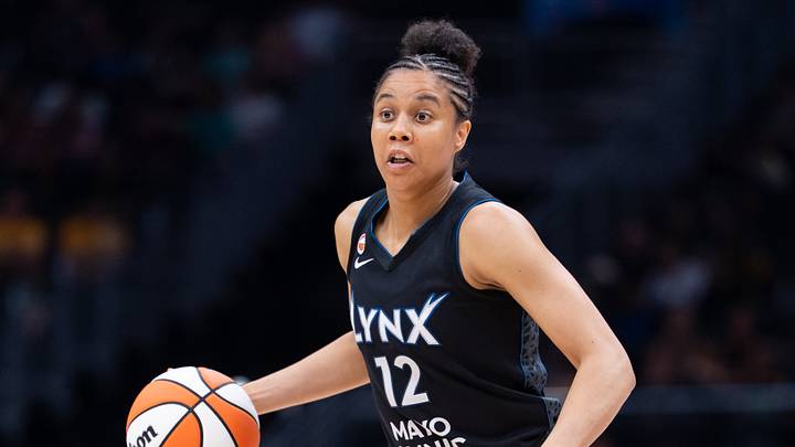 Jul 22, 2026; Seattle, Washington, USA;  Minnesota Lynx forward Nia Coffey (12) dribbles the ball against the Seattle Storm at Climate Pledge Arena. Mandatory Credit: Stephen Brashear-Imagn Images