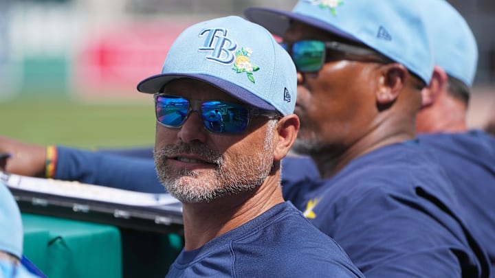 Feb 26, 2026; Fort Myers, Florida, USA; Tampa Bay Rays manager Kevin Cash looks on from the dugout during the fourth inning against the Boston Red Sox at JetBlue Park at Fenway South. 