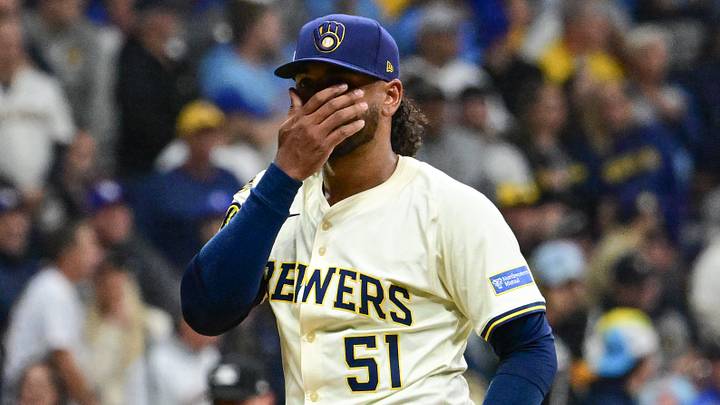 Oct 14, 2025; Milwaukee, Wisconsin, USA; Milwaukee Brewers pitcher Freddy Peralta (51) reacts after giving up a solo home run to Los Angeles Dodgers right fielder Teoscar Hernandez (not pictured) in the second inning during game two of the NLCS round for the 2025 MLB playoffs at American Family Field. Mandatory Credit: Benny Sieu-Imagn Images Oct 14, 2025; Milwaukee, Wisconsin, USA; Milwaukee Brewers pitcher Freddy Peralta (51) reacts after giving up a solo home run to Los Angeles Dodgers right fielder Teoscar Hernandez (not pictured) in the second inning during game two of the NLCS round for the 2025 MLB playoffs at American Family Field. Mandatory Credit: Benny Sieu-Imagn Images