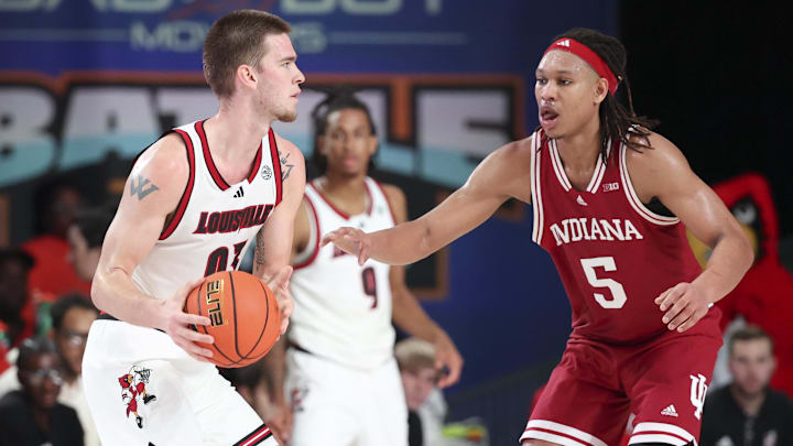 Nov 27, 2024; Paradise Island, Bahamas, BHS; Louisville Cardinals forward Noah Waterman (93) looks to score as Indiana Hoosiers forward Malik Reneau (5) defends during the second half at the Atlantis Resort. Mandatory Credit: Kevin Jairaj-Imagn Images Nov 27, 2024; Paradise Island, Bahamas, BHS; Louisville Cardinals forward Noah Waterman (93) looks to score as Indiana Hoosiers forward Malik Reneau (5) defends during the second half at the Atlantis Resort. Mandatory Credit: Kevin Jairaj-Imagn Images