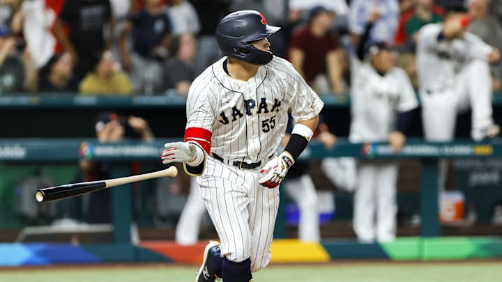 Mar 20, 2023; Miami, Florida, USA; Japan third baseman Munetaka Murakami (55) hits a walk-off double to win the game against Mexico during the ninth inning at LoanDepot Park. Mandatory Credit: Sam Navarro-Imagn Images