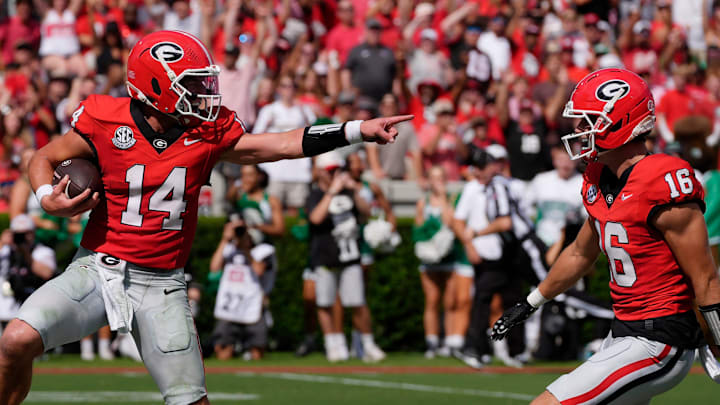 Georgia quarterback Gunner Stockton (14) celebrates with Georgia wide receiver London Humphreys (16) while walking in for a touchdown during the first half of a NCAA college football game against Marshall in Athens, Ga., on Saturday, August. 30, 2025. Georgia quarterback Gunner Stockton (14) celebrates with Georgia wide receiver London Humphreys (16) while walking in for a touchdown during the first half of a NCAA college football game against Marshall in Athens, Ga., on Saturday, August. 30, 2025.