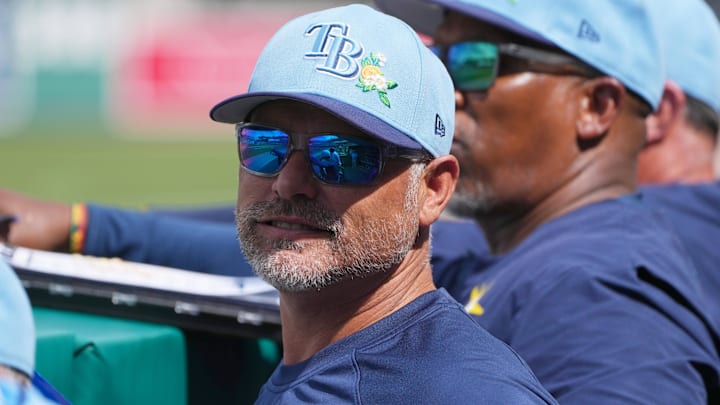 Feb 26, 2026; Fort Myers, Florida, USA; Tampa Bay Rays manager Kevin Cash looks on from the dugout during the fourth inning against the Boston Red Sox at JetBlue Park at Fenway South. 