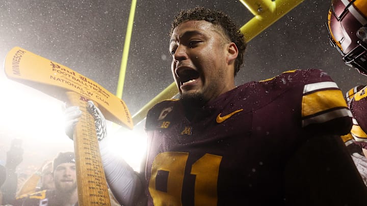 Nov 29, 2025; Minneapolis, Minnesota, USA; Minnesota Golden Gophers defensive lineman Deven Eastern (91) celebrates with Paul Bunyan’s Axe after the game against the Wisconsin Badgers at Huntington Bank Stadium. Nov 29, 2025; Minneapolis, Minnesota, USA; Minnesota Golden Gophers defensive lineman Deven Eastern (91) celebrates with Paul Bunyan’s Axe after the game against the Wisconsin Badgers at Huntington Bank Stadium.