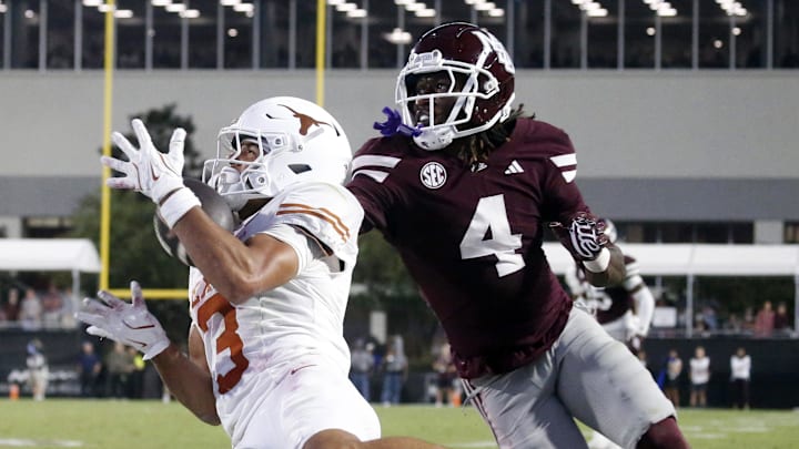 Texas Longhorns wide receiver Emmett Mosley V (3) catches the ball for a touchdown as Mississippi State Bulldogs defensive back DeAgo Brumfield (4) defends during the fourth quarter at Davis Wade Stadium at Scott Field.