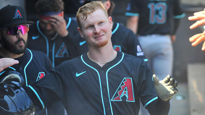 Jun 25, 2025; Chicago, Illinois, USA; Arizona Diamondbacks designated hitter Pavin Smith (26) celebrates with teammates in the dugout after scoring during the eighth inning against the Chicago White Sox at Rate Field. Mandatory Credit: Patrick Gorski-Imagn Images Jun 25, 2025; Chicago, Illinois, USA; Arizona Diamondbacks designated hitter Pavin Smith (26) celebrates with teammates in the dugout after scoring during the eighth inning against the Chicago White Sox at Rate Field. Mandatory Credit: Patrick Gorski-Imagn Images