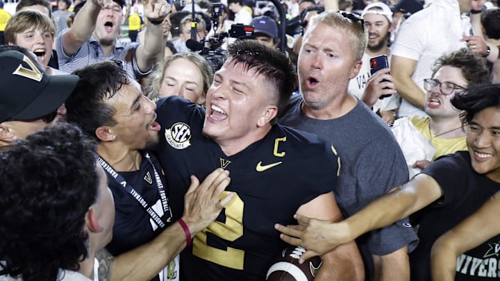 Vanderbilt Commodores quarterback Diego Pavia celebrates with fans after defeating the Alabama Crimson Tide at FirstBank Stadium.