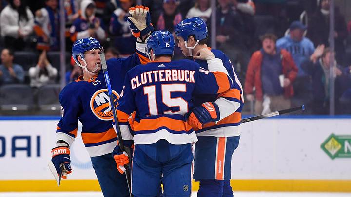 Jan 17, 2022; Elmont, New York, USA;  New York Islanders center Casey Cizikas (53) and New York Islanders right wing Cal Clutterbuck (15) celebrate the goal by New York Islanders left wing Matt Martin (17) during the third period at UBS Arena. Mandatory Credit: Dennis Schneidler-Imagn Images